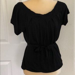 Black blouse with belt.